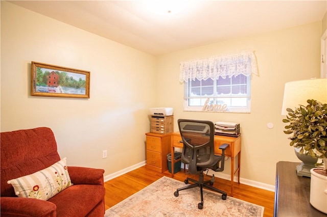 home office featuring wood finished floors and baseboards