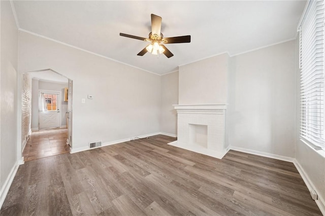 3474 Ligonier St, Lawrenceville, PA 15201 - unfurnished living room with healthy amount of natural light, wood finished floors, crown molding, and baseboards