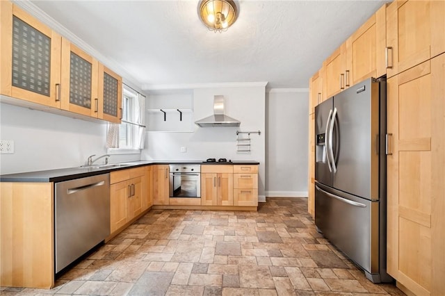 3474 Ligonier St, Lawrenceville, PA 15201 - kitchen featuring appliances with stainless steel finishes, light brown cabinetry, wall chimney exhaust hood, a sink, and stone tile flooring