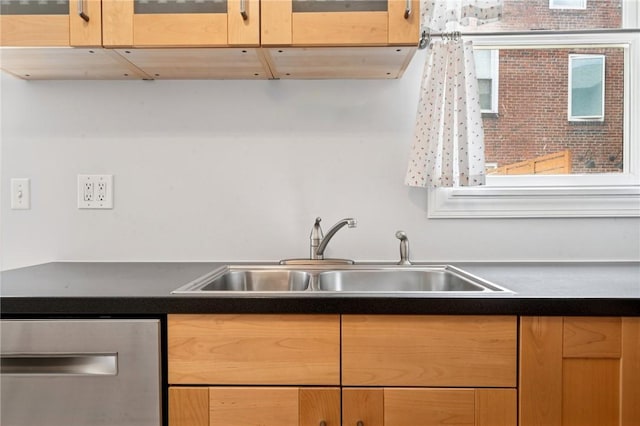 3474 Ligonier St, Lawrenceville, PA 15201 - kitchen with a sink, stainless steel dishwasher, dark countertops, and glass insert cabinets