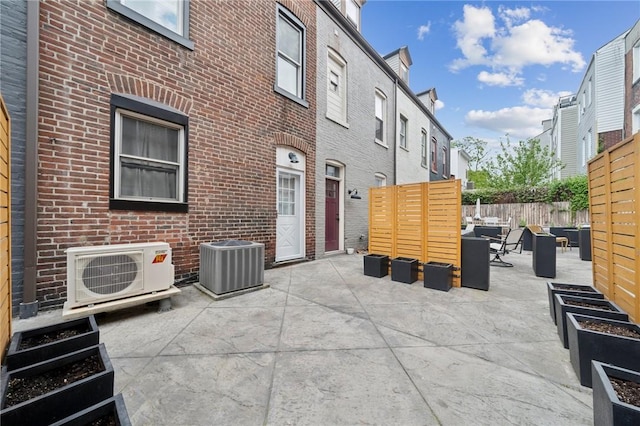 3474 Ligonier St, Lawrenceville, PA 15201 - view of patio featuring ac unit, outdoor lounge area, central AC, and fence