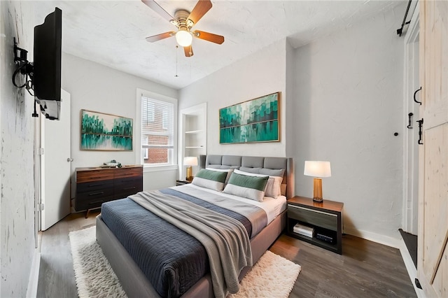 3474 Ligonier St, Lawrenceville, PA 15201 - bedroom with wood finished floors, a ceiling fan, and baseboards