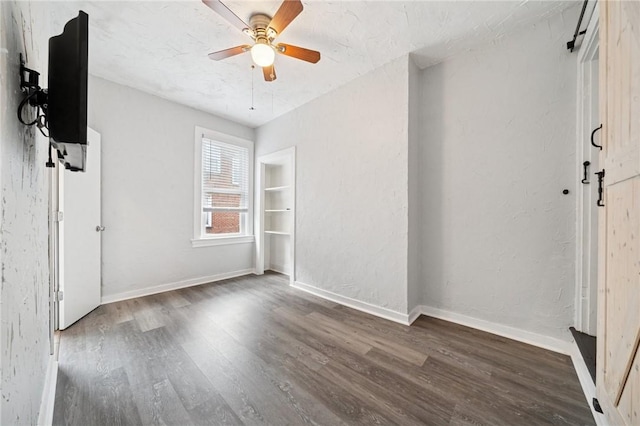 3474 Ligonier St, Lawrenceville, PA 15201 - unfurnished bedroom featuring wood finished floors, baseboards, and ceiling fan