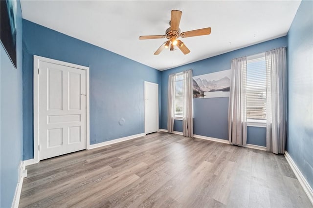 3474 Ligonier St, Lawrenceville, PA 15201 - unfurnished room featuring healthy amount of natural light, wood finished floors, and baseboards