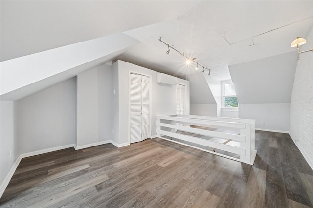 3474 Ligonier St, Lawrenceville, PA 15201 - additional living space featuring a wall mounted air conditioner, wood finished floors, lofted ceiling, and baseboards