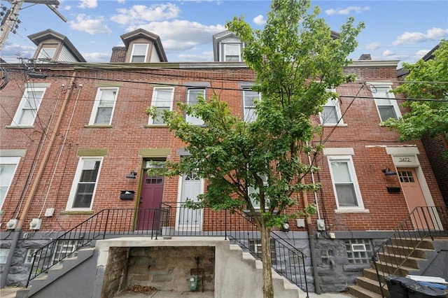 3474 Ligonier St, Lawrenceville, PA 15201 - townhome / multi-family property with brick siding and stairway