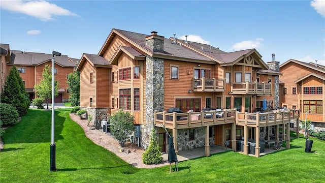 166 Southwind Dr, Seven Springs Resort, PA 15622 - rear view of property with stone siding, a yard, a patio, and a chimney
