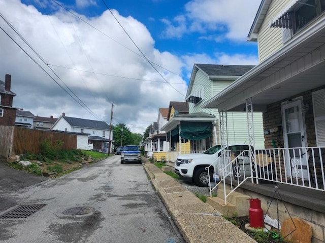 view of asphalt road featuring a residential view