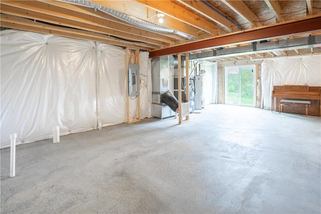 118 Leslie Farms Dr, Connoquenessing Boro, PA 16033 - below grade area featuring water heater, electric panel, and heating unit