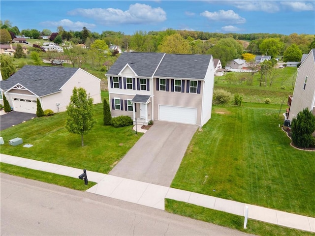 118 Leslie Farms Dr, Connoquenessing Boro, PA 16033 - traditional-style house featuring asphalt driveway, a front yard, a garage, a residential view, and roof with shingles