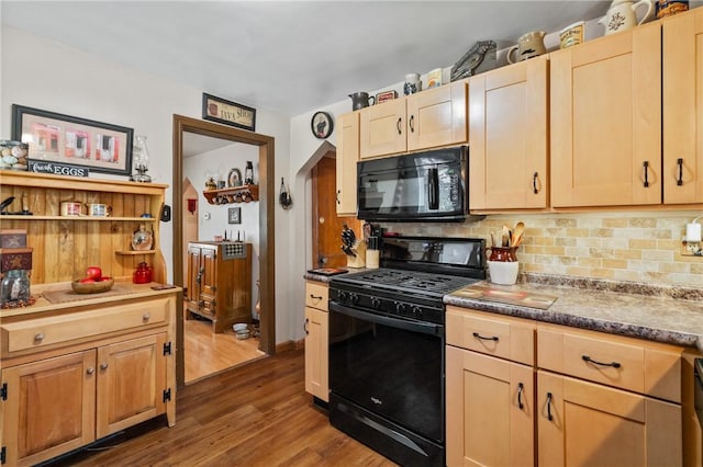 kitchen with black appliances, dark wood finished floors, backsplash, and light brown cabinetry