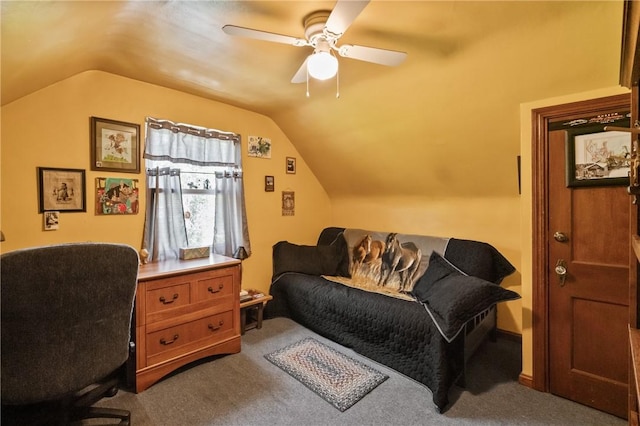 home office with lofted ceiling, a ceiling fan, and carpet