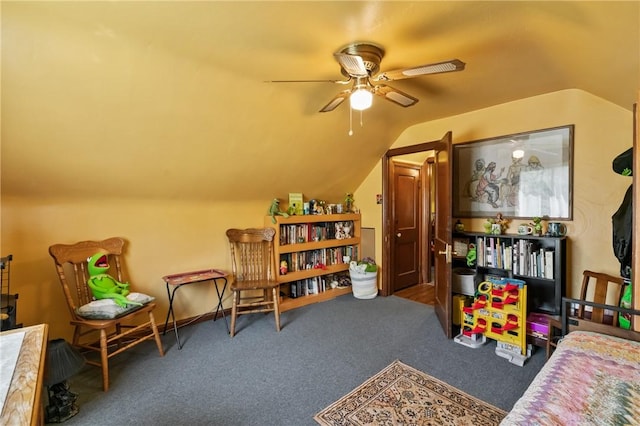 game room with a ceiling fan, carpet flooring, and vaulted ceiling