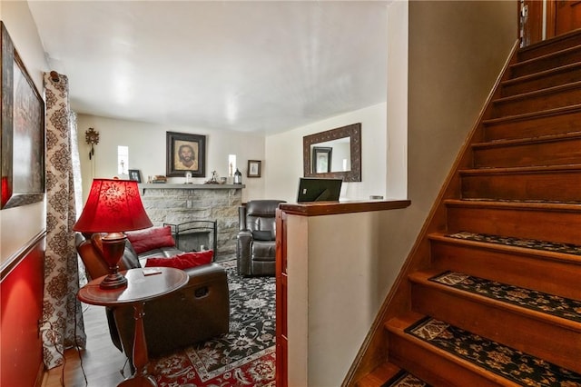stairs with a stone fireplace