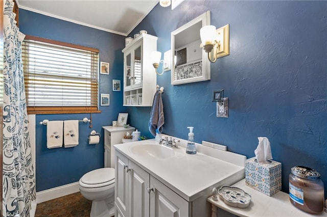full bath featuring toilet, crown molding, baseboards, and vanity