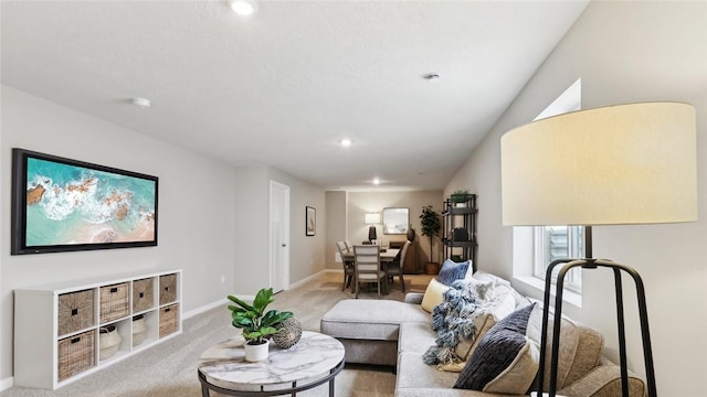 living area with carpet, baseboards, and recessed lighting