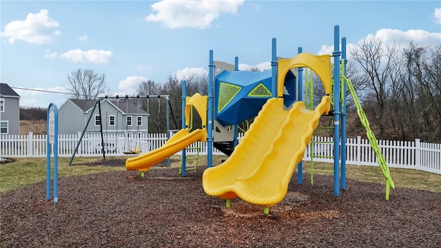 communal playground featuring fence