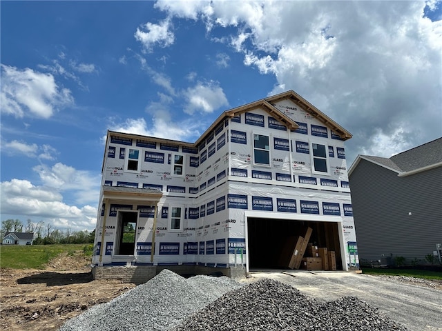 view of front of property with driveway and a garage