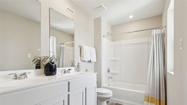 full bathroom with toilet, shower / bath combo with shower curtain, double vanity, and wood finished floors