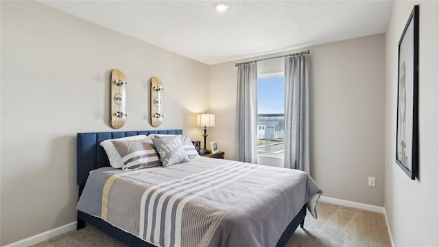 bedroom with carpet floors and baseboards
