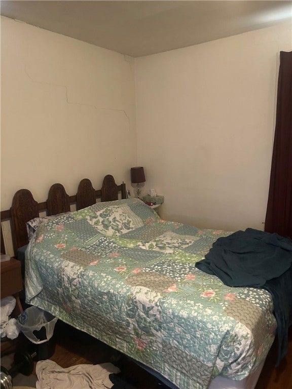 bedroom featuring wood finished floors