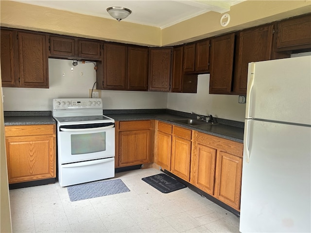 704/706 Holland St, Vandergrift Wml, PA 15690 - kitchen featuring white appliances, a sink, dark countertops, and light flooring
