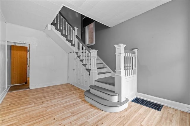 3014 Versailles Ave, Mckeesport, PA 15132 - stairs featuring wood finished floors and baseboards