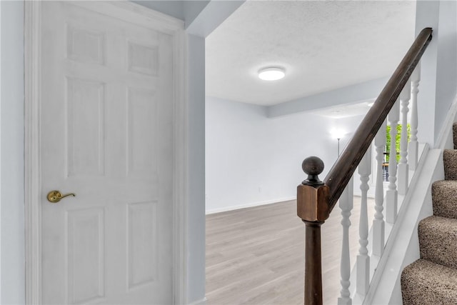 1408 Timberidge Dr, Bethel Park, PA 15102 - stairway with baseboards, wood finished floors, and a textured ceiling