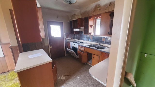 1710 3rd Ave, New Brighton, PA 15066 - kitchen with a sink, extractor fan, brown cabinets, tasteful backsplash, and light countertops