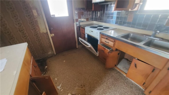 1710 3rd Ave, New Brighton, PA 15066 - kitchen with healthy amount of natural light, white electric range, backsplash, and brown cabinets