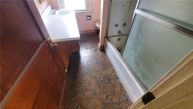 1710 3rd Ave, New Brighton, PA 15066 - bathroom with toilet, stone finish floors, enclosed tub / shower combo, and vanity