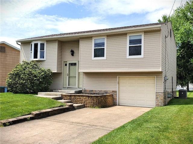 620 Gross St, Conway, PA 15027 - bi-level home with a garage, a front yard, stone siding, and central AC