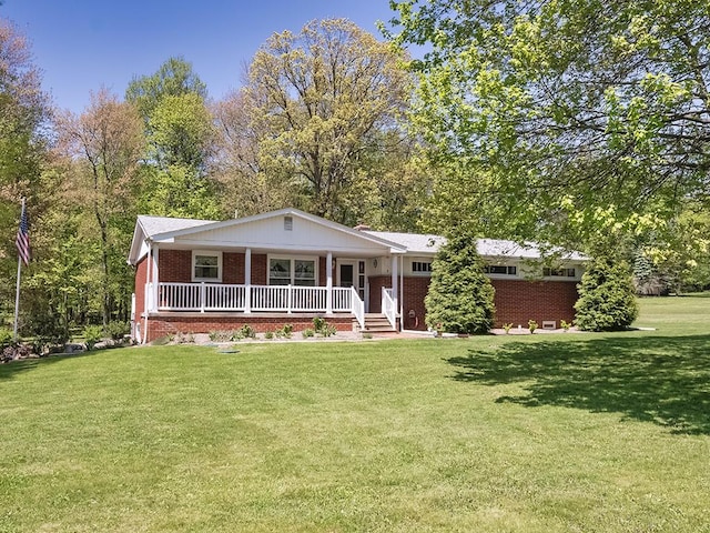 349 Marwood Rd, Winfield Twp, PA 16023 - view of front of home featuring brick siding, a porch, and a front yard
