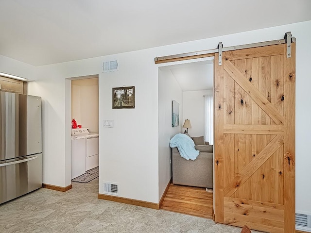 349 Marwood Rd, Winfield Twp, PA 16023 - interior space with separate washer and dryer, a barn door, and baseboards