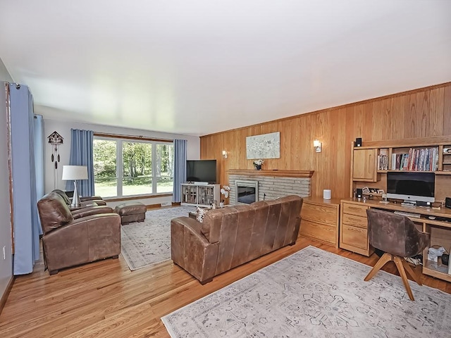 349 Marwood Rd, Winfield Twp, PA 16023 - living area featuring an office area, wooden walls, light wood finished floors, and a fireplace