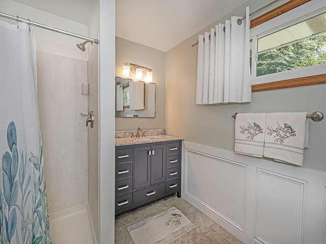 349 Marwood Rd, Winfield Twp, PA 16023 - bathroom featuring a shower with shower curtain, a wainscoted wall, vanity, and a decorative wall