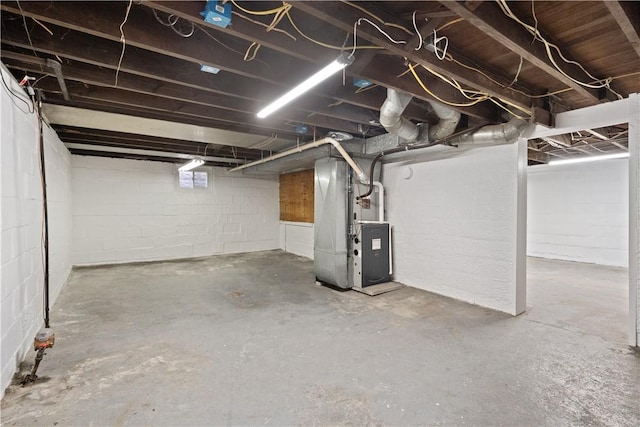 716 Center Ave N, Charleroi, PA 15022 - unfinished basement featuring heating unit and concrete block wall