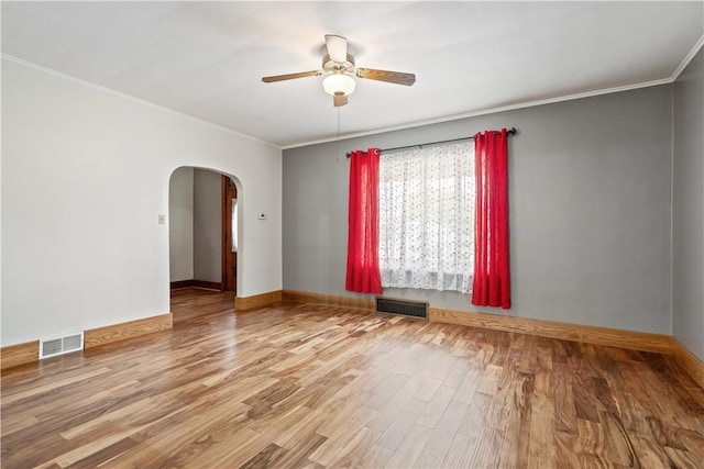 716 Center Ave N, Charleroi, PA 15022 - unfurnished room with arched walkways, ceiling fan, ornamental molding, wood finished floors, and baseboards