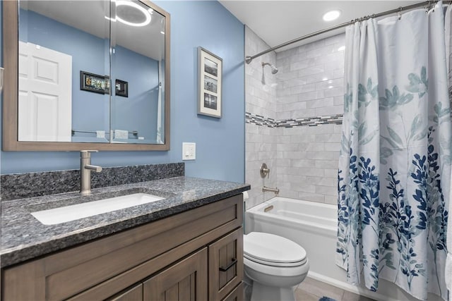 full bathroom featuring shower / bath combination with curtain, toilet, and vanity