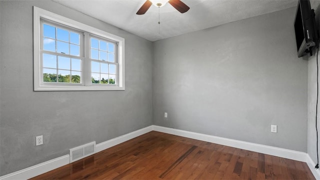 172 Orchard Dr, Pleasant Hills, PA 15236 - unfurnished room with baseboards, dark wood-type flooring, and a ceiling fan