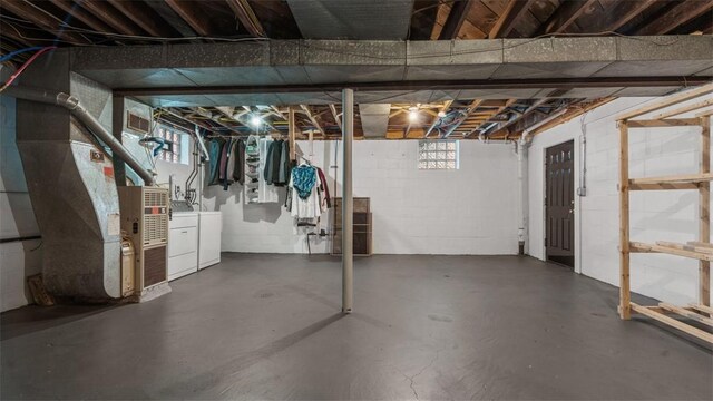 172 Orchard Dr, Pleasant Hills, PA 15236 - basement featuring washing machine and clothes dryer, heating unit, and concrete block wall