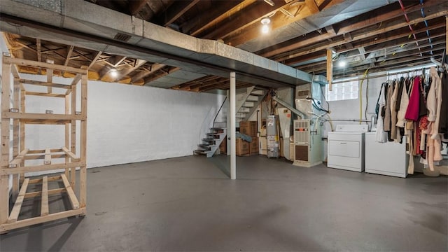 172 Orchard Dr, Pleasant Hills, PA 15236 - below grade area featuring washing machine and clothes dryer, gas water heater, stairs, and heating unit