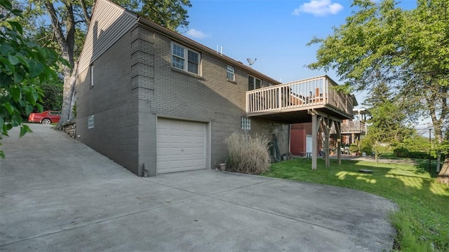 172 Orchard Dr, Pleasant Hills, PA 15236 - rear view of property with a garage, a lawn, driveway, a wooden deck, and brick siding