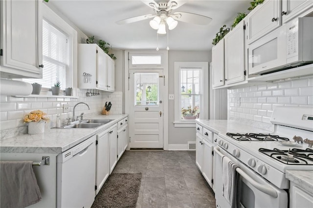 363 Highland Ave, West View, PA 15229 - kitchen featuring white appliances, a sink, light countertops, ceiling fan, and white cabinets