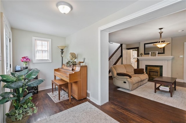 363 Highland Ave, West View, PA 15229 - sitting room featuring wood finished floors, baseboards, stairs, and a fireplace