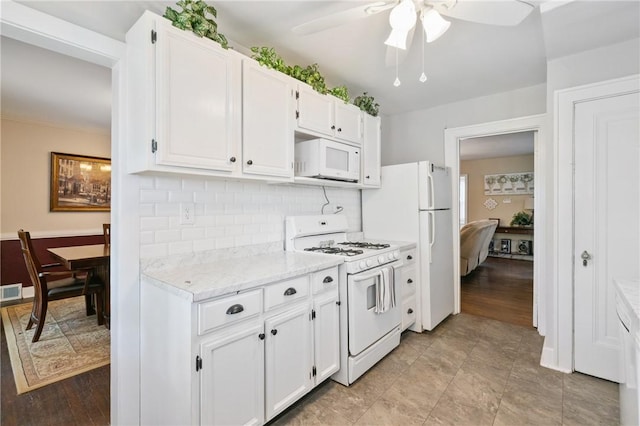 363 Highland Ave, West View, PA 15229 - kitchen featuring white appliances, a ceiling fan, tasteful backsplash, white cabinetry, and light stone counters