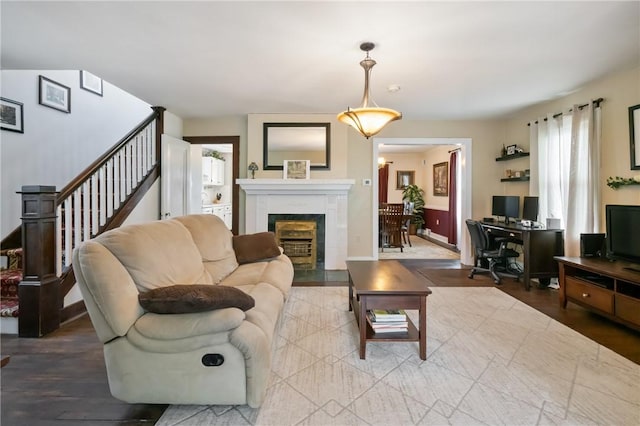 363 Highland Ave, West View, PA 15229 - living room with a desk, a fireplace with flush hearth, wood finished floors, and stairs