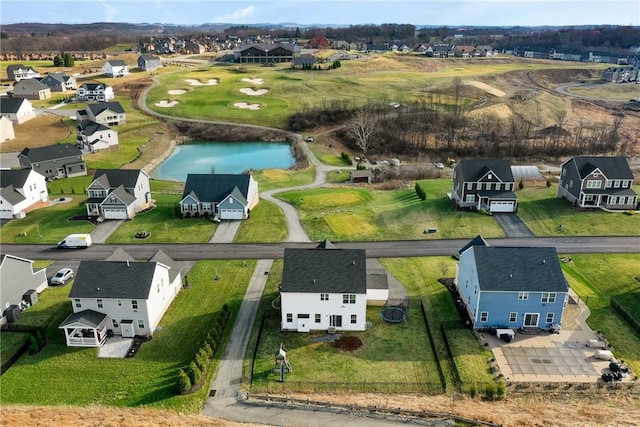 aerial view of residential area featuring a nearby body of water and a golf club