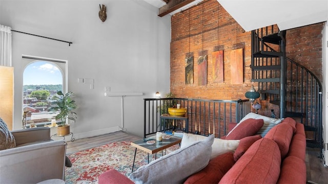 2132 Sarah St Unit 201, South Side, PA 15203 - living area with a towering ceiling, wood finished floors, and baseboards
