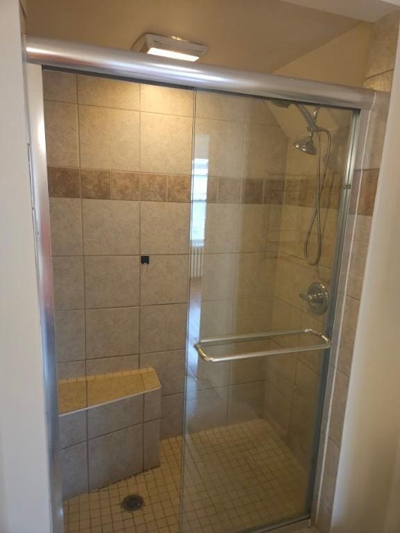 full bath featuring a shower stall
